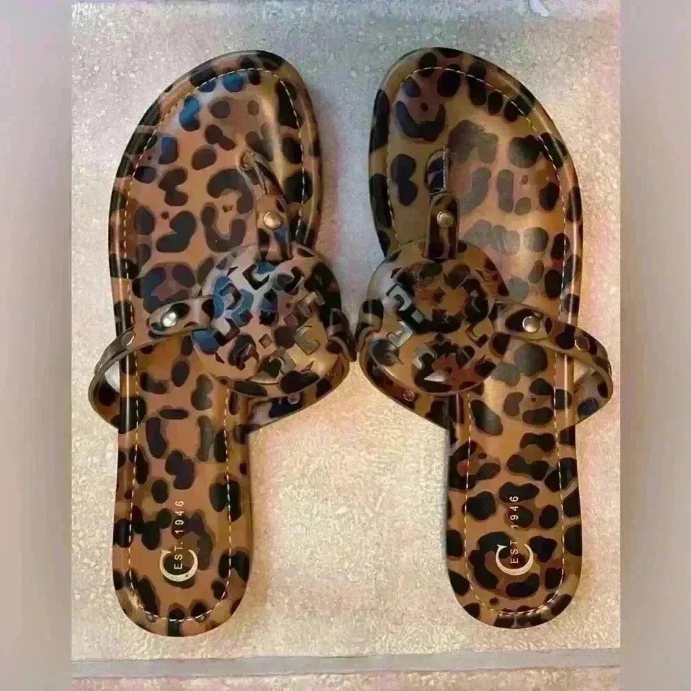 C'est brown/tan,animal print, medallion center women’s slip on sandal; size 9